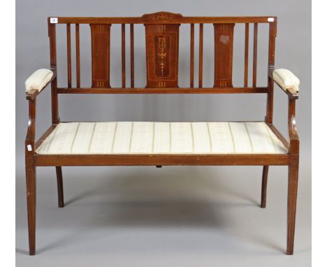 A late Victorian inlaid show-wood two-seater salon sofa having a padded seat &amp; arms, &amp; on square tapered legs, 110cm 
