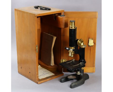 A vintage black lacquered monocular microscope by Bausch &amp; Lomb of America (No. 149960), with case.