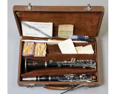 A Boosey &amp; Hawkes ebony clarinet “The Edgware” with chrome fittings, 70cm long, cased.