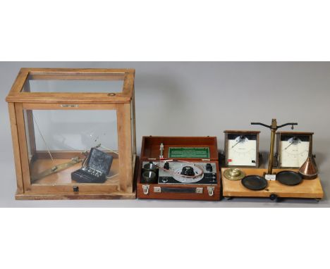 An electronic switchgear electrolytic conductivity measuring set in a mahogany case; an amp meter &amp; voltmeter; &amp; two 