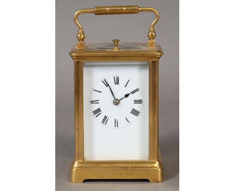 A French gilt-brass carriage clock with push-repeat movement sticking on a coiled gong, the white enamel dial with black roma