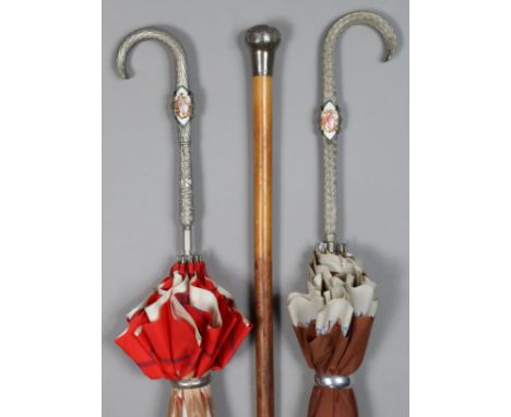 An Edwardian gent’s walking cane with a silver handle, 92cm long, London 1908; &amp; two Italian umbrellas, each inset painte