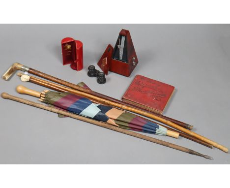 A modern Witther (German) metronome; together with an album mixed cigarette cards; a pair of opera glasses; four walking cane