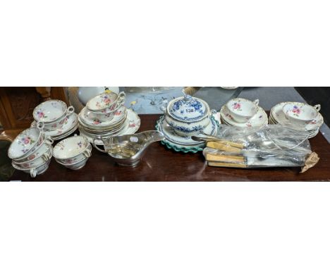 A Victorian floral decorated thirty-one-piece part tea service; a silver plated sauce boat; various items of cutlery, etc. pa