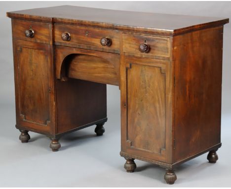 A 19th century mahogany small break-front pedestal sideboard fitted three frieze drawers with fluted knob handles &amp; a cen