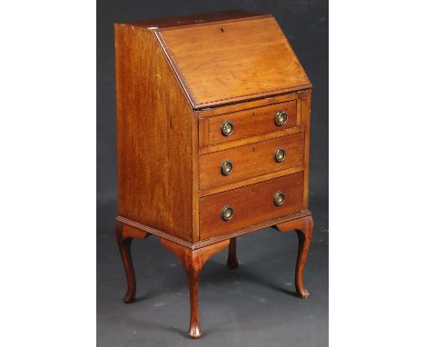 An Edwardian inlaid-mahogany small bureau with a fitted interior enclosed by a fall-front above three long graduated drawers 