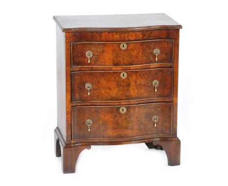 ANTIQUE WALNUT SERPENTINE THREE DRAWER DESK WITH LIFT TOP LID ON BRACKET FEET.HEIGHT: 30 INCHESWIDTH: 24 INCHESDEPTH: 15 INCH