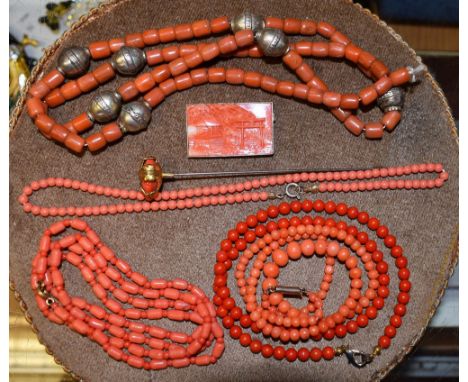 Costume Jewellery - a rectangular carved Coral brooch, temple gate and hut with trees, silver coloured metal frame;  a simila