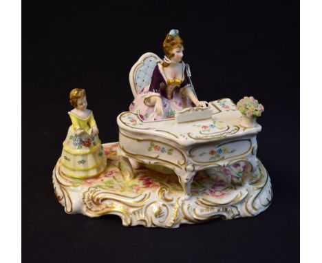 A Wallendorfer Porzellan figural group, of an 18th century aristocratic mother and child playing piano and reading, scrolling