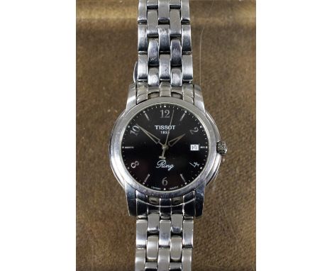 Tissot - a ring wristwatch, black dial, raised alternate Arabic numerals and block baton markers, minute track, centre second