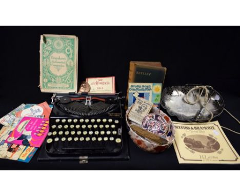 A Remington portable typewriter; a Georges Clemenceau medallion; Jaques playing cards; Agnes Scout whitste; ruler; Stork cook