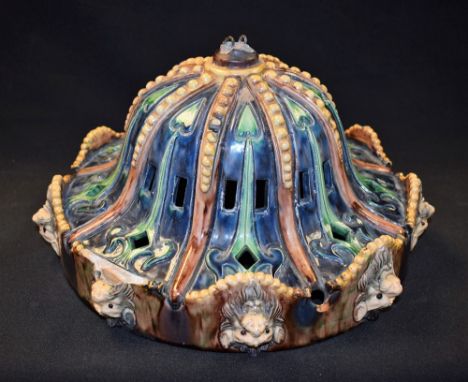 A Majolica ceiling light with lion mask rim