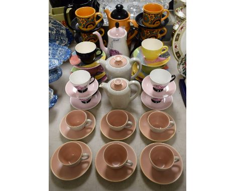 A Staffordshire retro coffee set, printed in black and orange; a four place abstract pattern tea set; a Staffordshire floral 