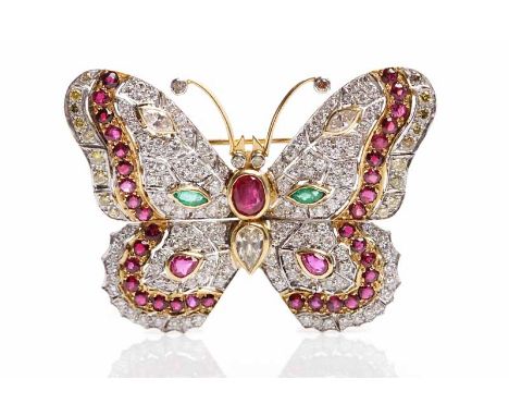DIAMOND, EMERALD AND RUBY SET BUTTERFLY BROOCHpierced and set with stones of various cuts, unmarked, 50mm across