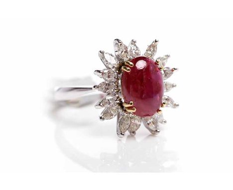 RUBY AND DIAMOND CLUSTER RINGthe central oval cabochon cut ruby surrounded by marquise cut diamonds, unmarked, size O