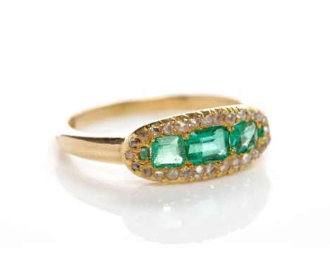 VICTORIAN EMERALD AND DIAMOND RINGthe three centrally set step cut emeralds surrounded by old cut diamonds, in eighteen carat