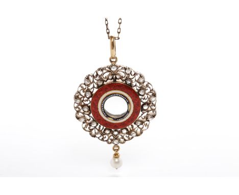 EARLY TWENTIETH CENTURY DIAMOND SET ENAMELLED PENDANTof circular form, the central crystal covered section within a red ename