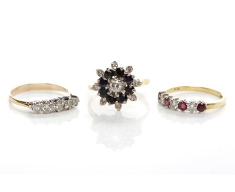 GROUP OF THREE DIAMOND RINGScomprising a ruby and diamond ring, a sapphire and diamond cluster ring and a diamond five stone 