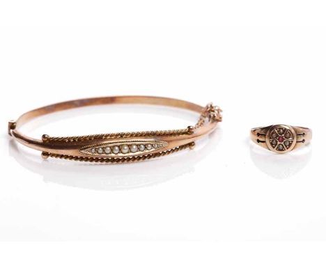 VICTORIAN GOLD BANGLEwith an elliptical section set with split pearls and with a ropetwist border, marked for nine carat gold