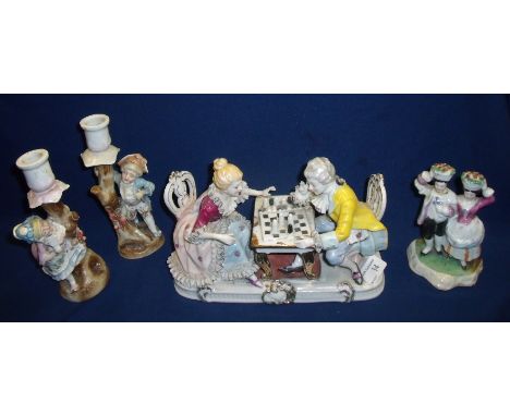 Selection of 19th/20th C porcelain figurines including a couple playing chess, pair of candlesticks with courting couple and 