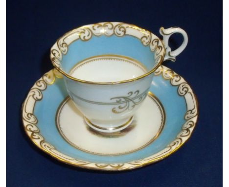 G Grainger Royal Porcelain Works Worcester 'Sole Manufacturer Of The Semi Porcelain Puce Ware' tea cup and saucer with pale b