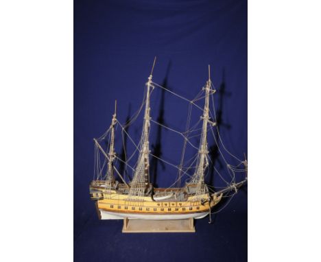 Scale wooden kit model of a triple masted ship on stand (overall length 66cm)