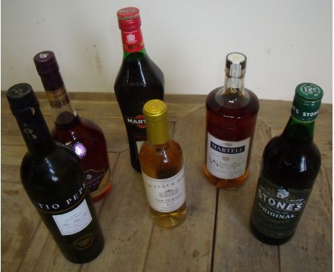 Bottle of Courvoisier Brandy, bottle of Martell Fine Cognac, bottle of Martini Rosso, bottle of Stones Original Ginger Wine a