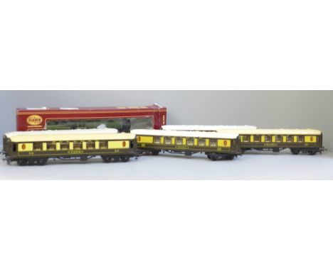A Tri-ang 00 gauge model locomotive, (Airfix box), and five Pullman coaches 