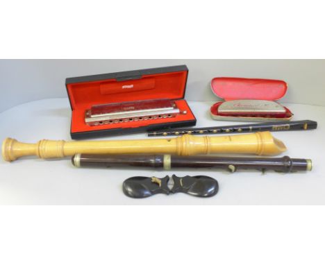 Musical instruments; a Larry Adler Professional 16 harmonica, one other, tin whistle, recorder, castanet and piccolo 