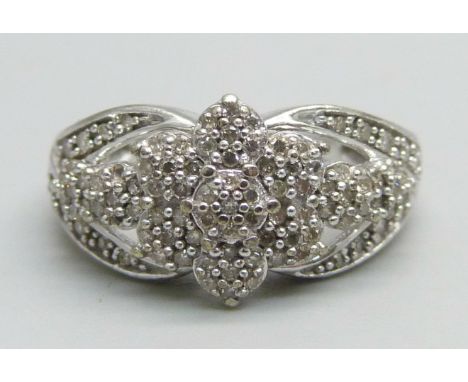 A 9ct white gold ring set with diamonds, 0.33ct, 3.6g, K 