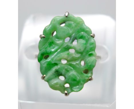 A white metal and carved jade ring, tests as 9ct gold, 2.9g, M/N 