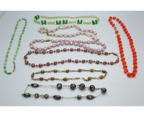 Eight vintage glass bead necklets 