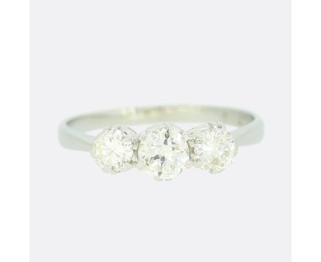 Vintage 0.60 Carat Diamond Three Stone Ring.             Weight:Â&nbsp;1.9 grams UK Ring Size:Â&nbsp;K Centre Diamond Carat W