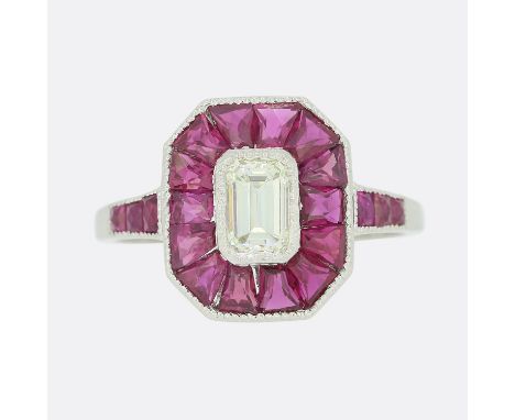 0.45 Carat Emerald Cut Diamond and Calibrated Ruby Ring.                       Weight:Â&nbsp;3.4 grams Size:Â&nbsp;M (53) Fac