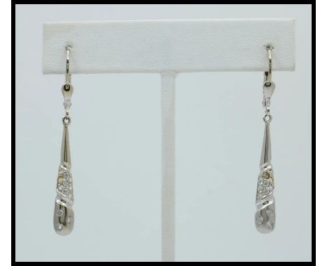 14K White Gold Diamond Dangling Earrings.                   Metal: 14K White Gold Weight:3.8 grams Measurement: 1.25â€ x 0.2â