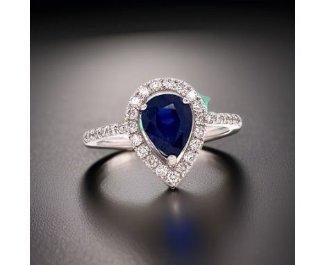 14K White Gold 1.65 Ct Sapphire And Diamond Halo Ring.      Halo Ring, 1 Pear Shape Sapphire 1.65 ct, Round Diamond 0.45 cttw