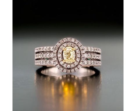 1.00 Cttw Fancy Yellow Diamond Ring.                        Ring, 1 Oval Fancy Yellow Diamond 0.35 ct, Round Diamond 0.65 ctt