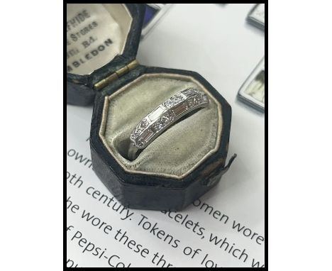 Antique Art Deco Platinum Diamond Band.                       Weight: 2.9 grams  Diamond: Approximately 0.40 cts  Ring Size: 