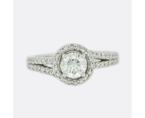 0.50 Carat Brilliant Cut Diamond Halo Ring.                        Weight:Â&nbsp;5.5 grams UK Ring Size:Â&nbsp;I Central Diam
