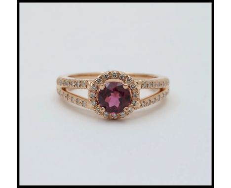Vintage 14K Rose Gold Rhodolite Garnet Diamond Ring.                          Metal: 14K Rose Gold Weight: 4.6 grams Garnet: 