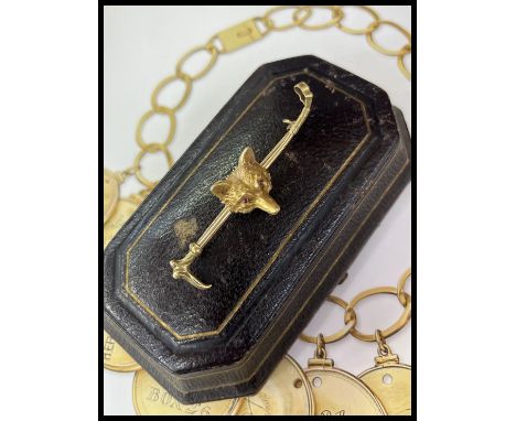 Vintage 14K Yellow Gold Fox Head &amp; Whip Bar Pin.             Metal: 14K Yellow Gold  Weight: 6.9 grams  Measurement: 0.65