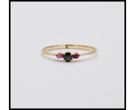 Vintage Blue Sapphire Ruby 14K Yellow Gold Ring.       Stones: Blue Sapphire (approx. 0.05 carats) Ruby (approx. 0.03 carats 