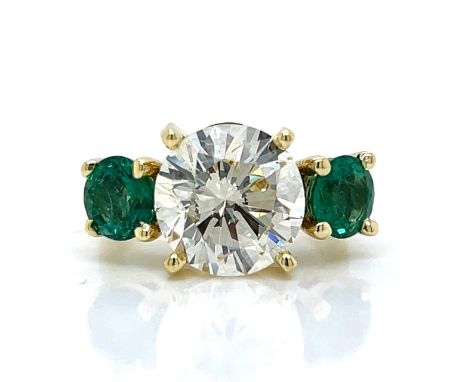 18K Yellow Gold GIA Certified 5.02 Ct. Diamond and Emerald Ring.                Weighing 8.2 grams Set with a GIA Certified 5