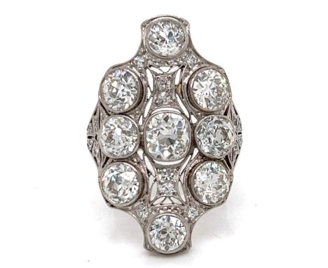 Art Deco Platinum Diamond Cocktail Ring.                         Weighing 8.7 grams Set with a 1.10 Ct. Diamonds in Center Al