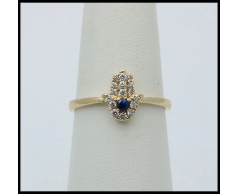 Vintage 10K Yellow Gold Diamond & Sapphire Hamsa Ring.                       Metal: 10K Yellow Gold Weight: 1.5 grams Diamond