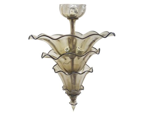 1930s. Important transparent blown glass chandelier in light smoky tones, made up of four conical cups arranged on several or