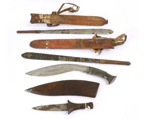 A Nepalese Kukri, the 28.5cm curved fullered steel blade with bevelled back edge, the horn grip with steel bolster and ellipt