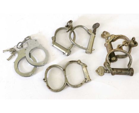 A Pair of Nickel Plated Iron Darby Style Adjustable Handcuffs by Hiatt, stamped HIATT BEST WARRANTED WROUGHT HARD 8 and with 
