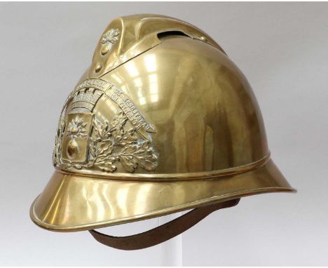 A French Brass Adrian Fire Helmet, with raised brass comb and helmet plate with ribbon legend embossed SAPPEURS POMPIERS DE. 