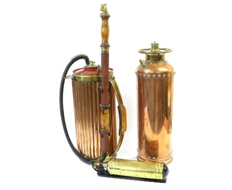 A Pre-1940 Brass Fire Extinguisher, with corrugated copper shell set with a beech handled hose; a Post-1950 Copper Fire Extin